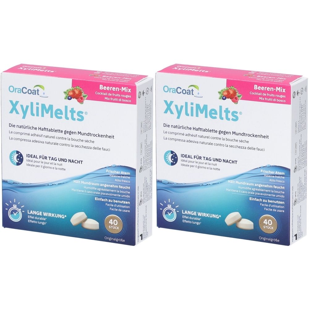 Zwei Schachteln OraCoat XyliMelts. Aufschrift: Beeren-Mix, 40 Stück. Ideal für Tag und Nacht. Lange Wirkung. Weiße Tabletten liegen vor den Schachteln.