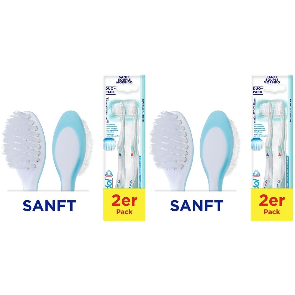 Zahnbürstenköpfe und Verpackungen. Aufschrift "SANFT" und "2er Pack". Blaue und weiße Zahnbürstenköpfe.