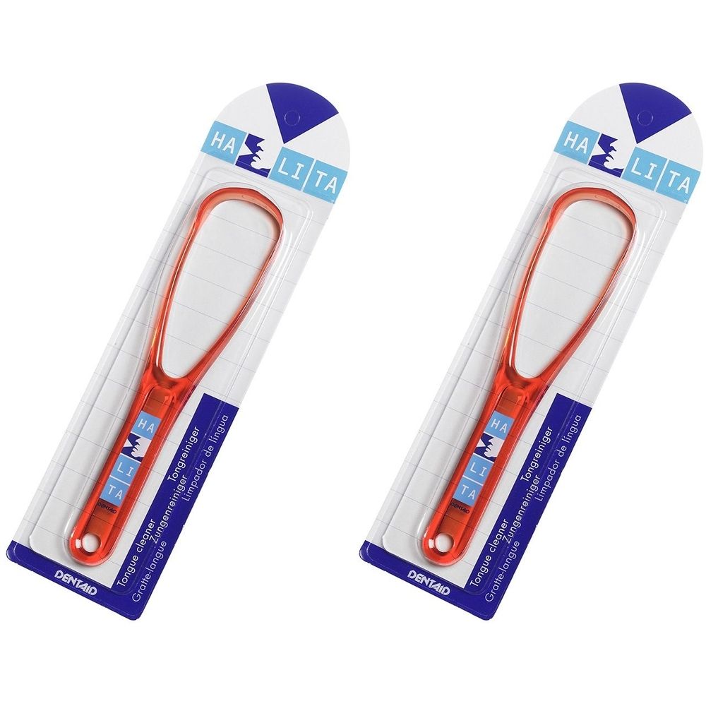 Zwei Zungenreiniger in Verpackung. Orangefarbener Kunststoff, ovaler Kopf, Griff mit Markenschriftzug HALITA. Verpackung mit Produktnamen.