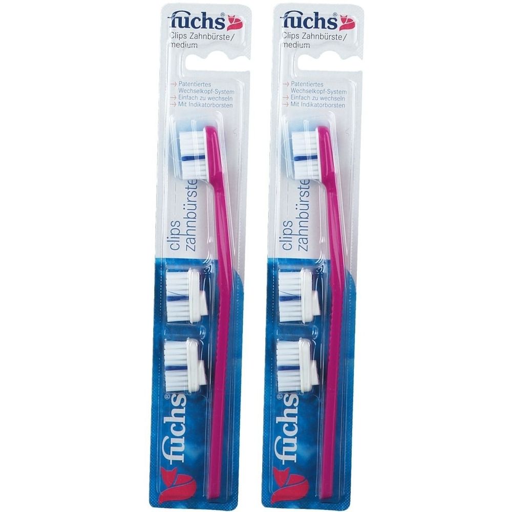 Zwei Zahnbürsten in Verpackung. Rosa Griff, weiße Bürstenköpfe und Ersatzköpfe. Marke: fuchs.