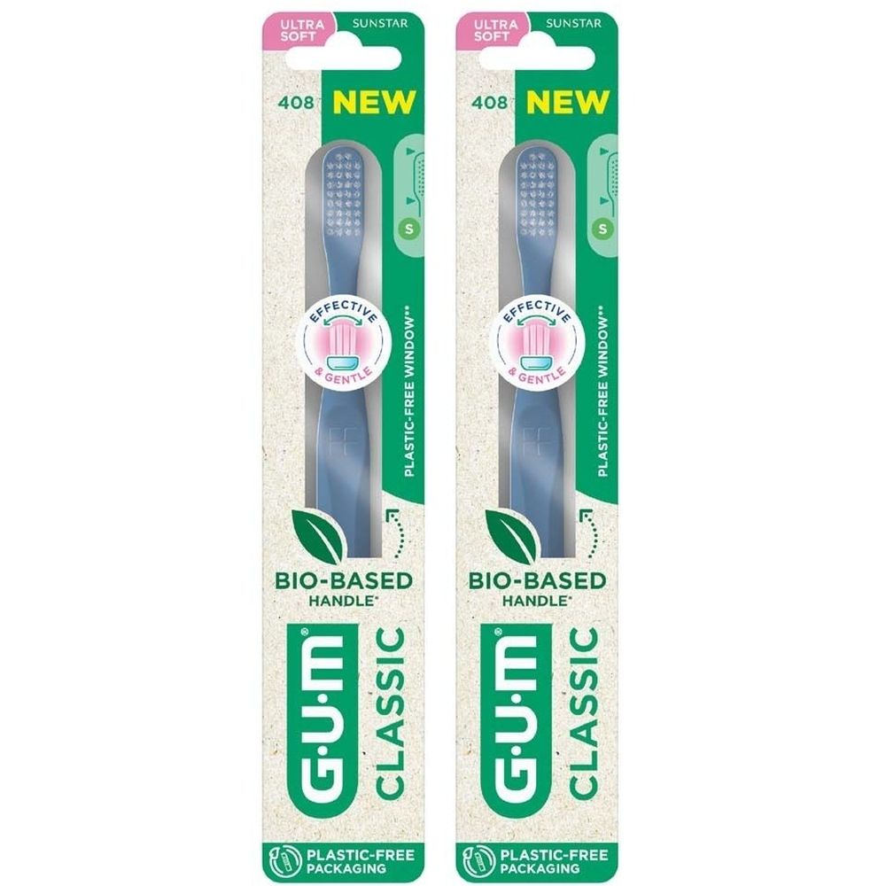 Zwei Zahnbürsten in Verpackung. Blaue Borsten, grünes Logo. Aufschrift: GUM Classic, ultrasoft, BIO-BASED HANDLE, NEW.