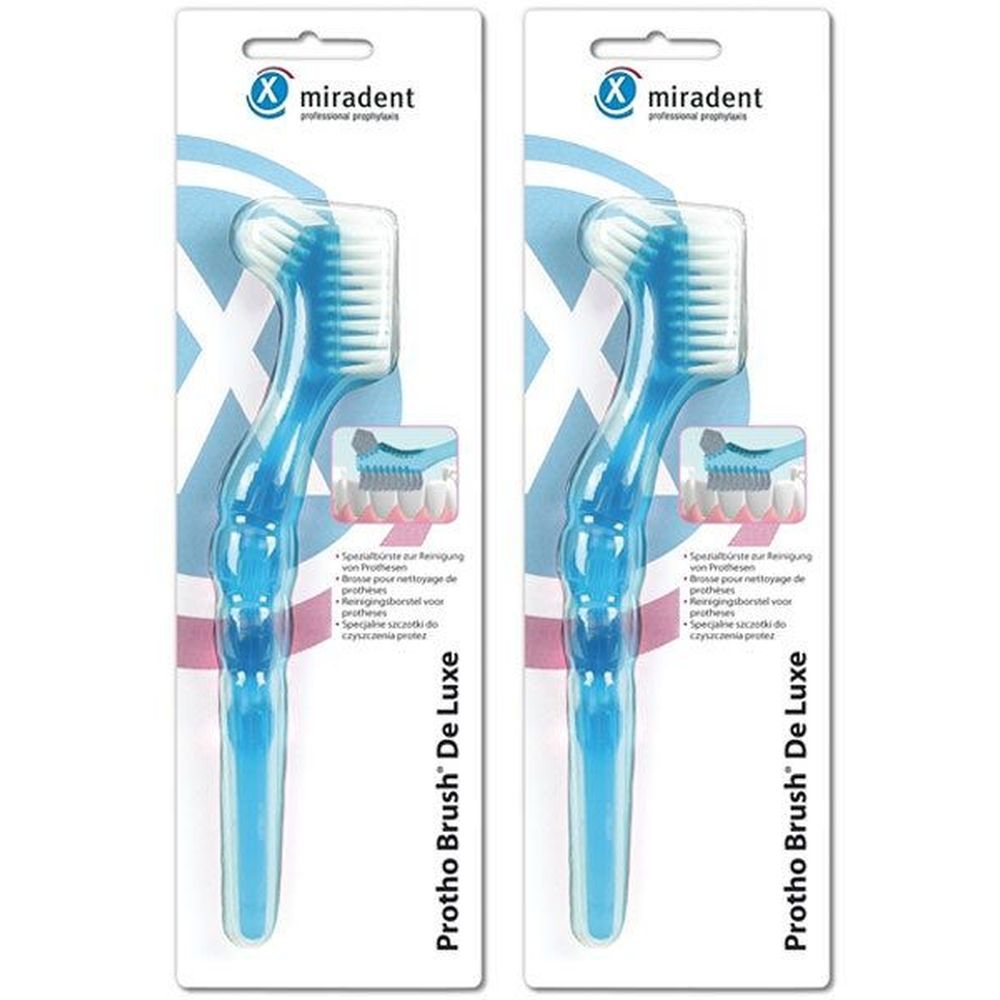 Zwei miradent Protho Brush De Luxe blau. Spezielle Zahnbürste für Prothesen. Verpackt auf Pappkarte mit Produktabbildung.
