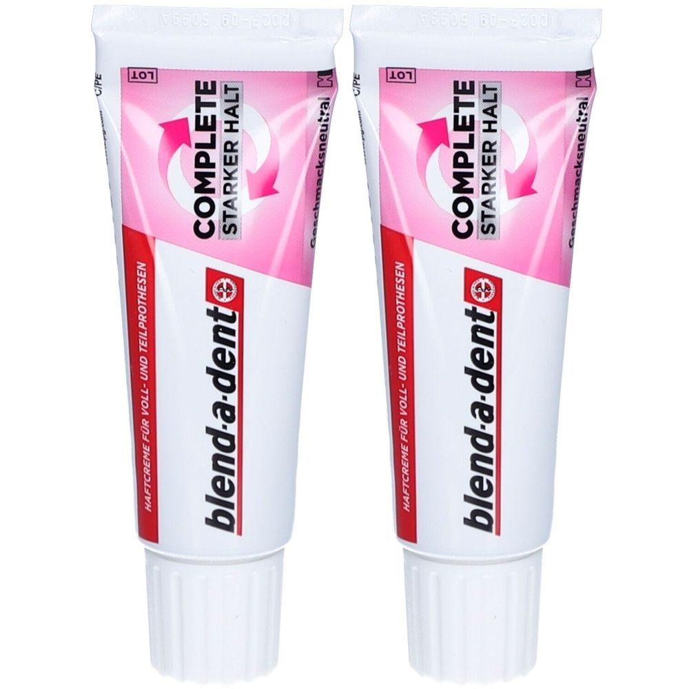 Zwei Tuben Haftcreme. Weiße Tuben mit rosa und roter Beschriftung. Text: COMPLETE, STARKER HALT, blend-a-dent.