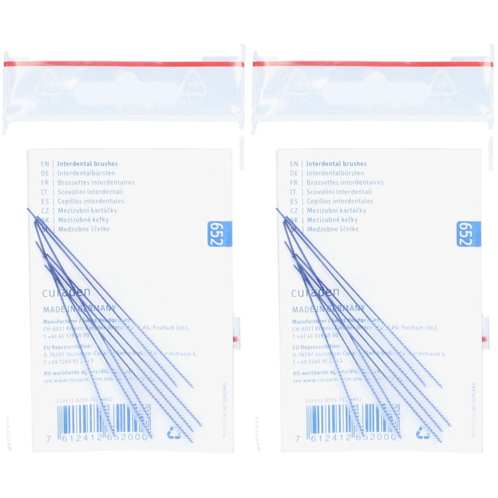 Zwei Packungen Interdentalbürsten. Weiße Verpackung mit blauen Borsten. Aufdrucke in mehreren Sprachen. Nummer 652 sichtbar.