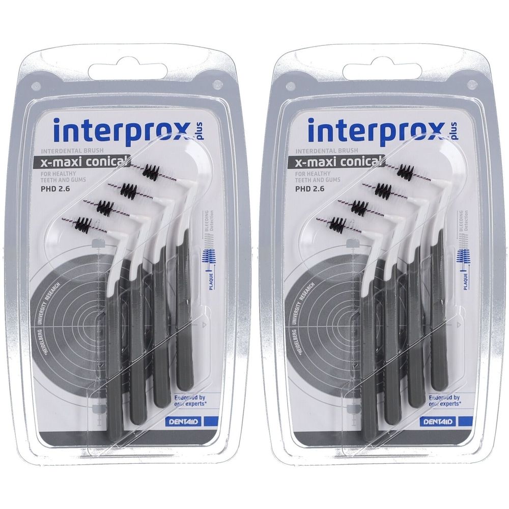 Zwei Blisterpackungen mit Interdentalbürsten. Schwarze und weiße Borsten, schwarze Griffe. Produktname und Details auf der Verpackung.