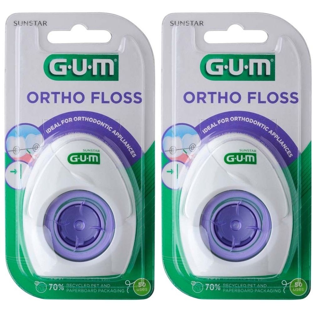 Zwei Packungen GUM Ortho Floss Zahnseide. Weiße Kunststoffbehälter mit lila Akzenten. Ideal für kieferorthopädische Geräte.