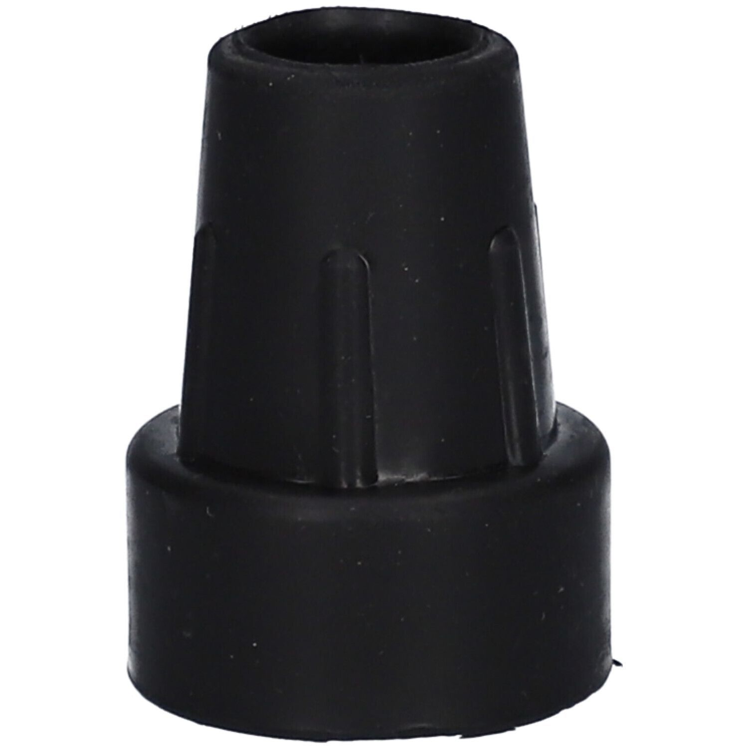 Schwarze Krückenkapsel. Kegelförmig mit geriffelter Oberfläche. Unterer Durchmesser größer als oberer.