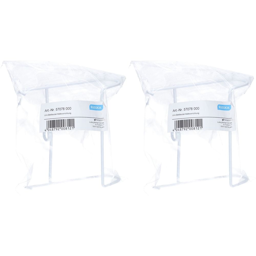 Zwei weiße Haltevorrichtungen in Plastikverpackung. Jede hat einen rechteckigen Rahmen und Haken. Aufkleber mit Artikelnummer und Barcode.