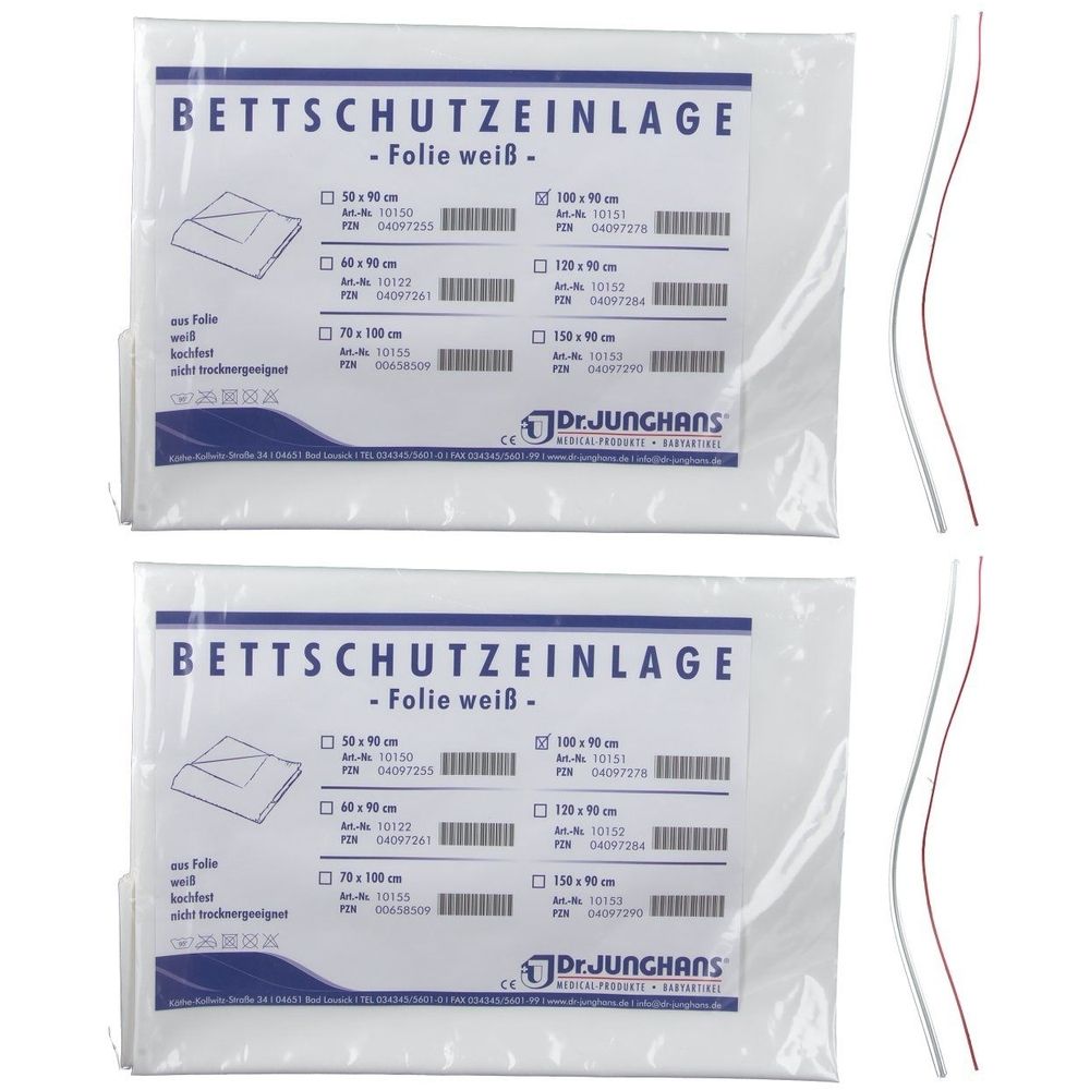 Zwei verpackte Bettschutzeinlagen. Aufschrift: Bettschutzeinlage - Folie weiß. Größenangaben: 90 x 100 cm. Marke: Dr. Junghans. Zwei gebogene Drähte.