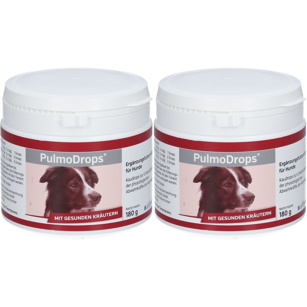 Zwei weiße Dosen mit rotem Band. Aufschrift PulmoDrops, Bild eines Hundes, Text. 180g. Ergänzungsfutter für Hunde.
