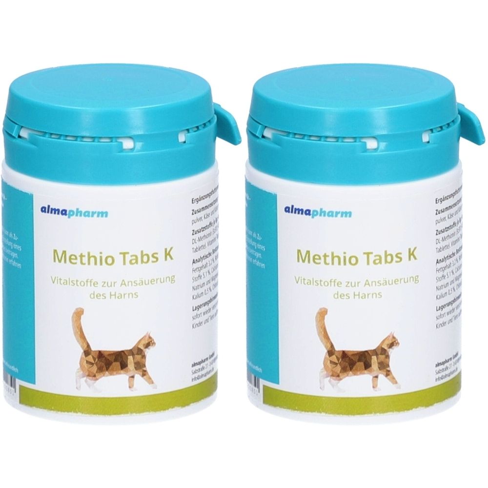 Zwei weiße Behälter mit blauem Deckel. Aufschrift: Methio Tabs K, Vitalstoffe zur Ansäuerung des Harns. Logo: Katze.