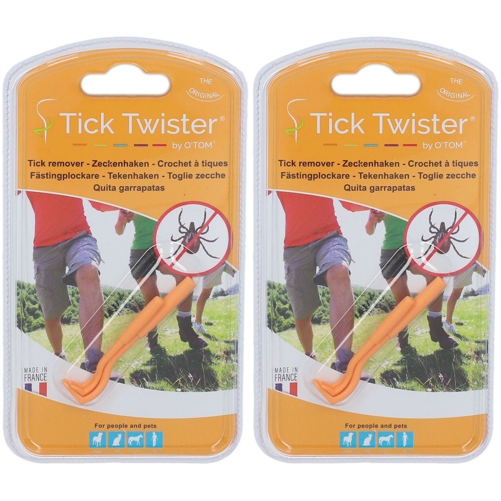 Zwei orangefarbene Zeckenhaken in Blisterverpackung. Aufschrift: Tick Twister. Text in mehreren Sprachen.