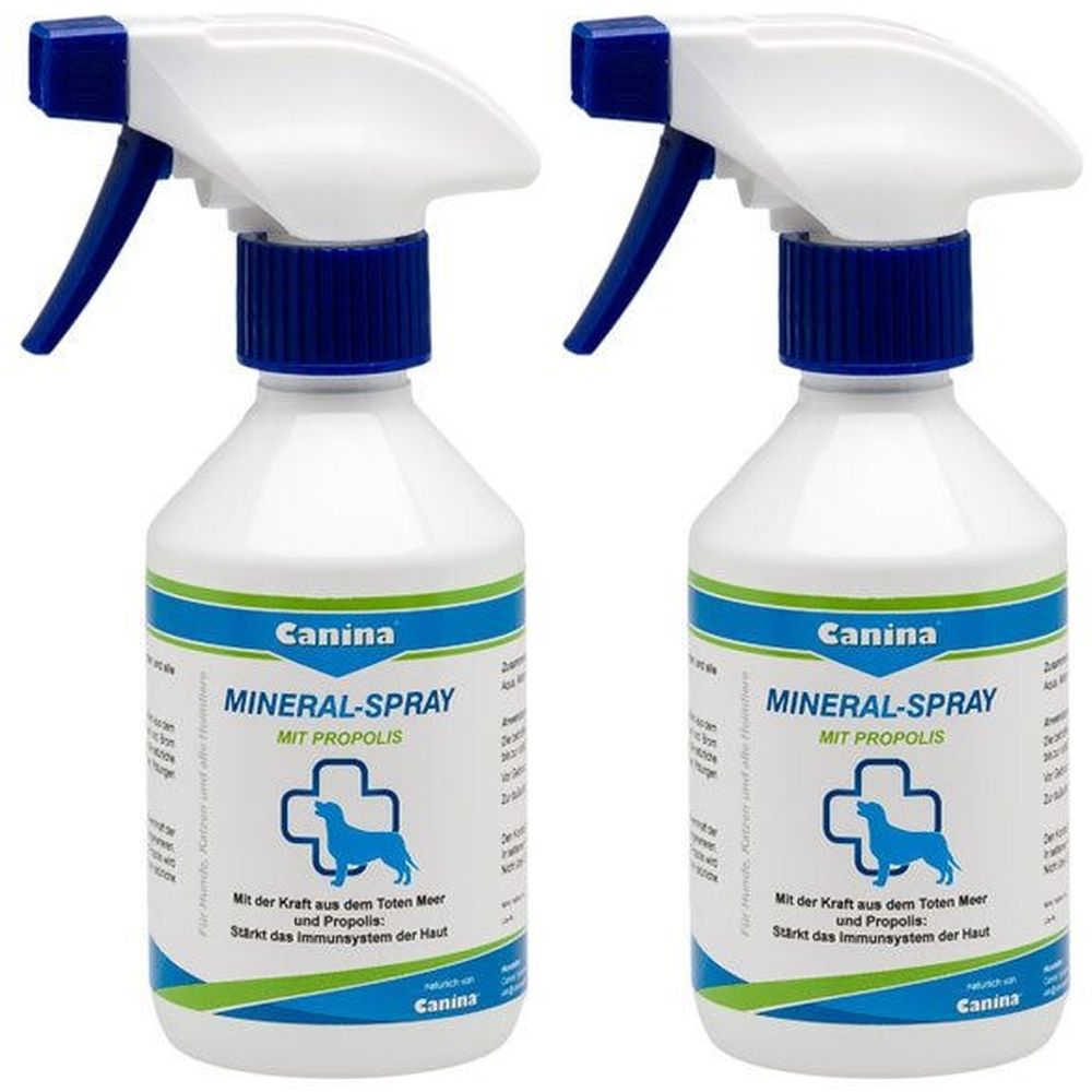 Zwei weiße Sprühflaschen mit blauem Sprühkopf. Aufschrift: Canina Mineral-Spray mit Propolis. Logo: Hund im Kreuz. Flaschenetikett mit Text.