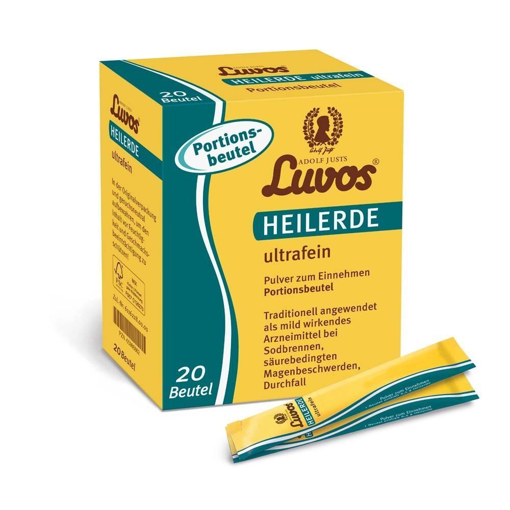Gelbe Schachtel mit "Luvos Heilerde ultrafein" und zwei gelben Beuteln. Aufschrift "20 Beutel".