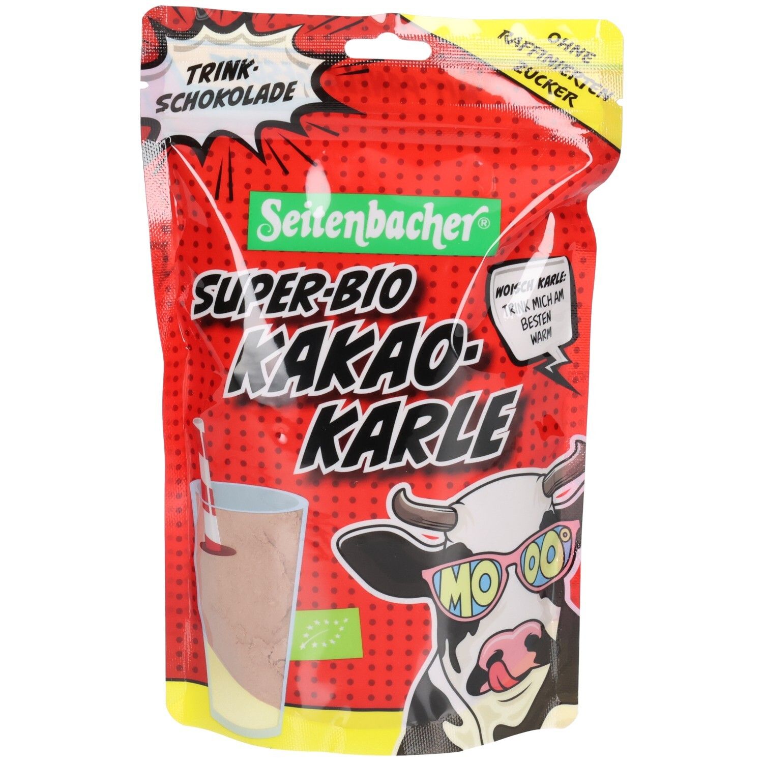 Verpackung von Seitenbacher® Super-Bio Kakao-Karle. Rote Tüte mit Produktname, Kuh-Illustration und Trinkschokolade-Hinweis.