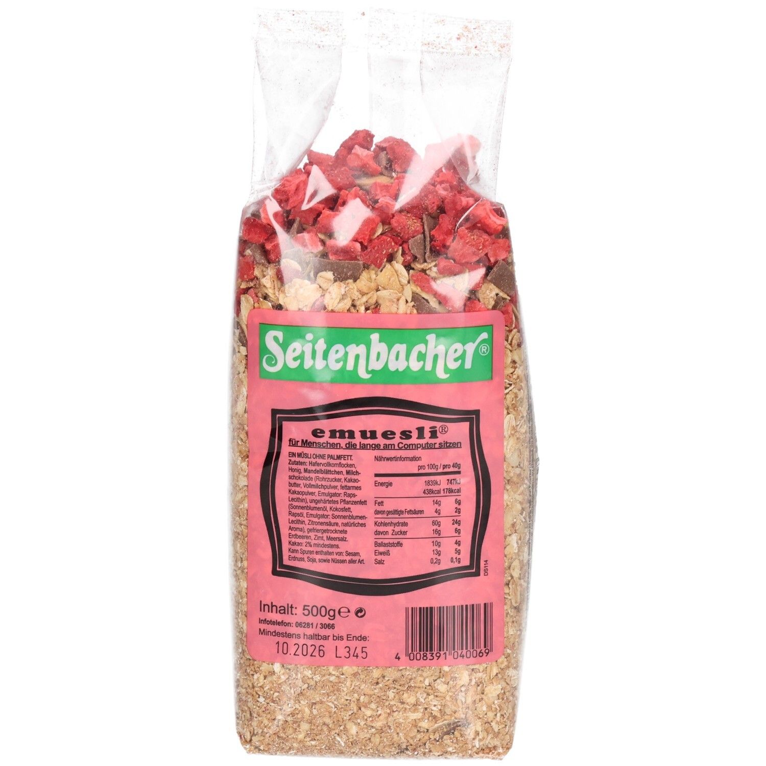 Transparente Verpackung mit Müsli. Haferflocken, Erdbeerstücke und Schokostückchen sichtbar. Auf der Verpackung steht "Seitenbacher" und "e-müsli".