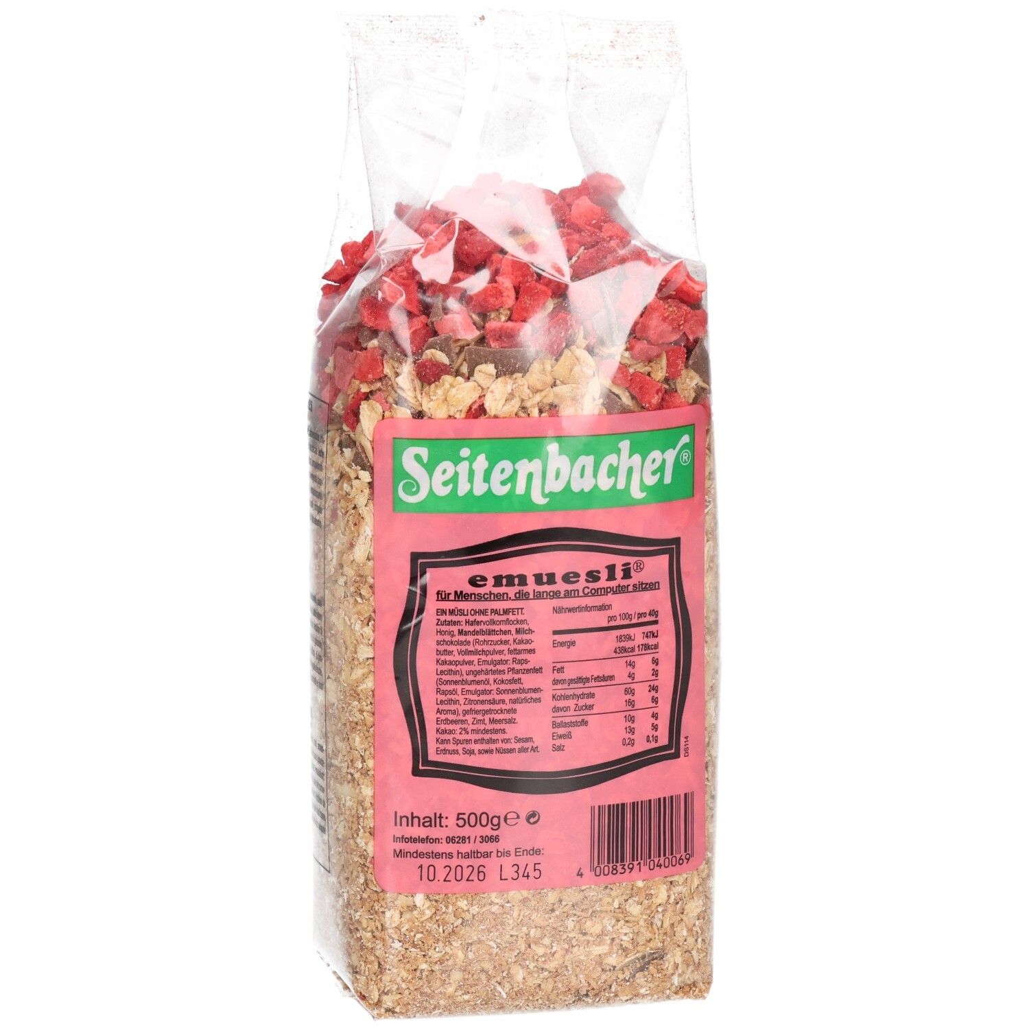 Transparente Verpackung mit Müsli. Haferflocken, Erdbeerstücke und Schokostückchen sichtbar. Auf der Verpackung steht "Seitenbacher" und "e-müsli".