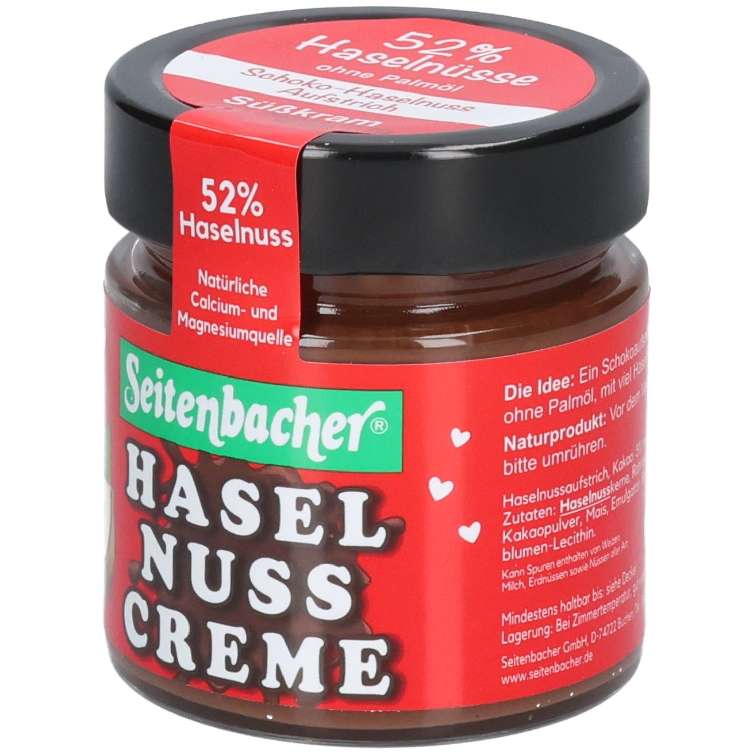 Glas mit Schoko-Haselnuss-Creme. Roter Aufkleber mit 52% Haselnuss. Marke: Seitenbacher. Schwarzer Deckel.