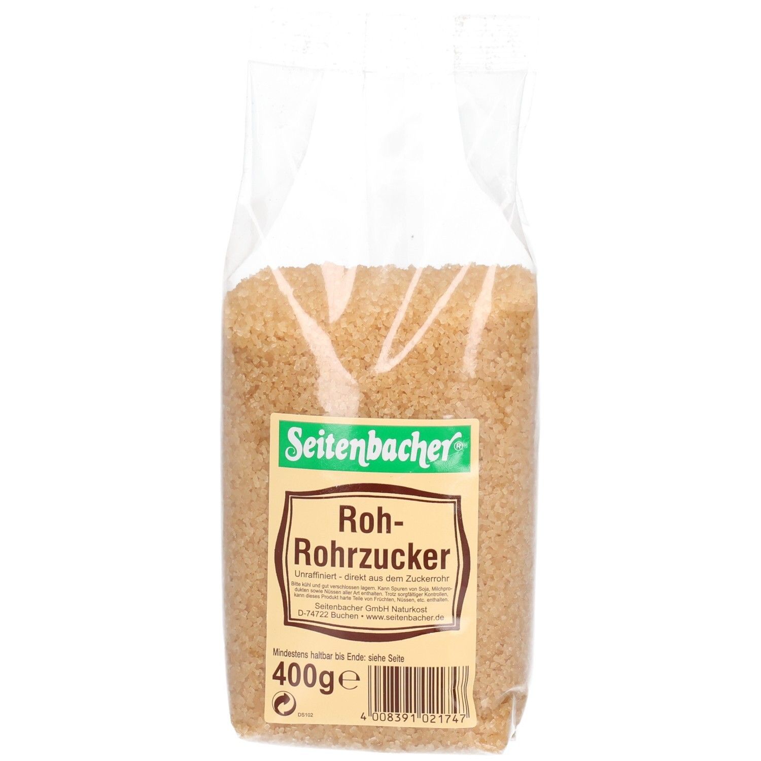 Brauner Rohrzucker in transparenter Verpackung. Seitenbacher-Etikett mit Produktinformationen und Gewicht.