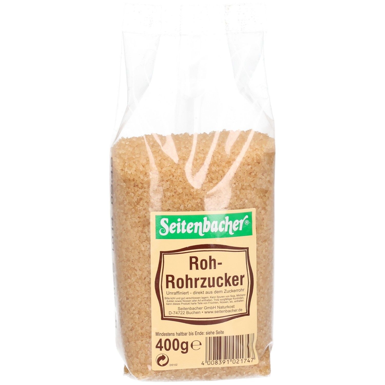 Brauner Rohrzucker in transparenter Verpackung. Seitenbacher-Etikett mit Produktbezeichnung und Gewicht.