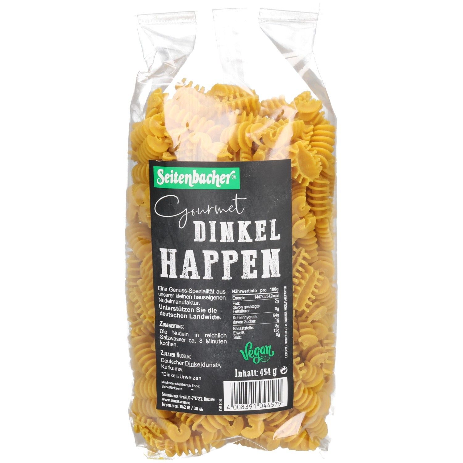 Klarsichtbeutel mit gelben Nudeln. Schwarzes Etikett: Seitenbacher Gourmet Dinkel Happen, vegan. Inhalt 454g.