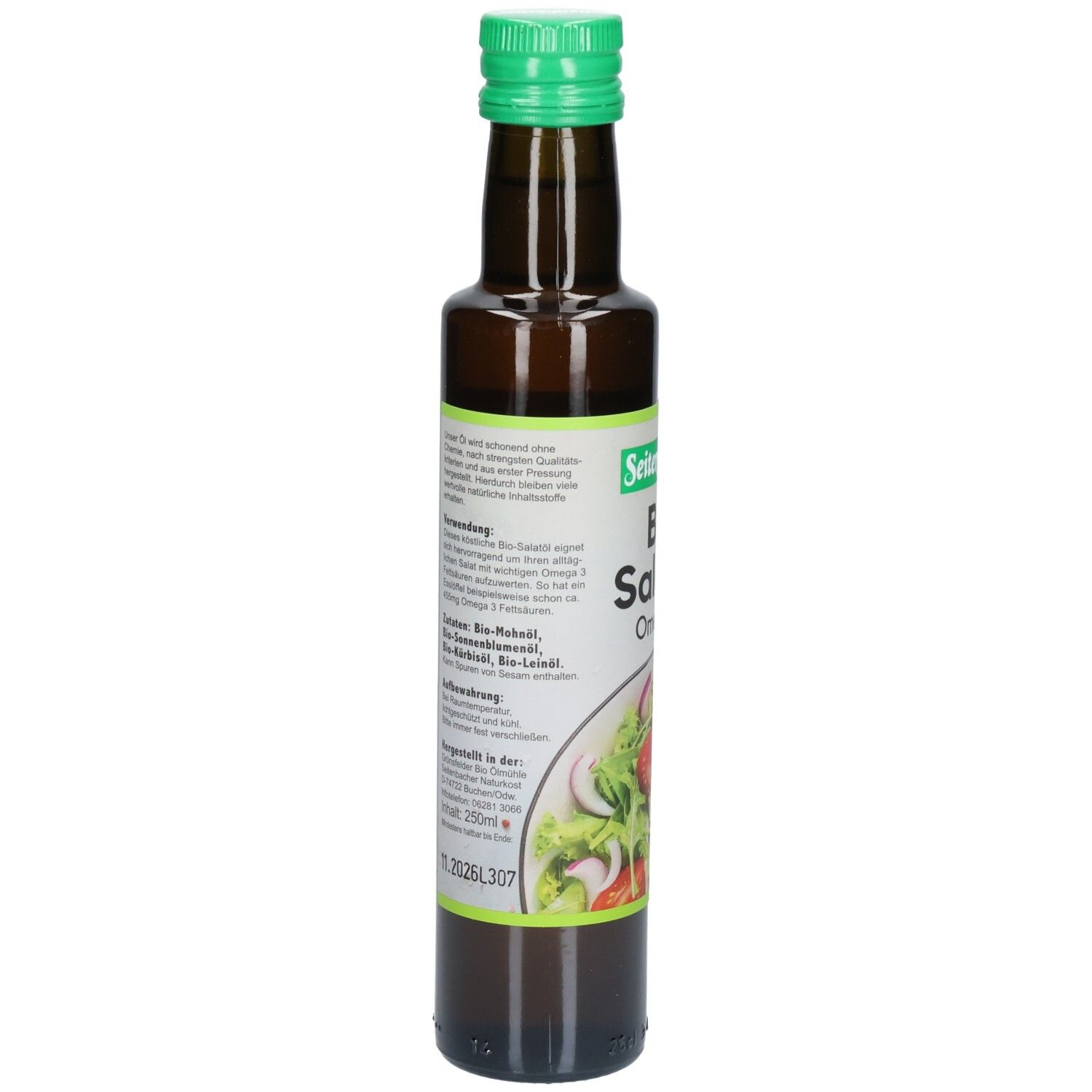 Braune Glasflasche mit grünem Deckel. Etikett mit Produktinformationen und Zutaten. Abbildung eines Salats.