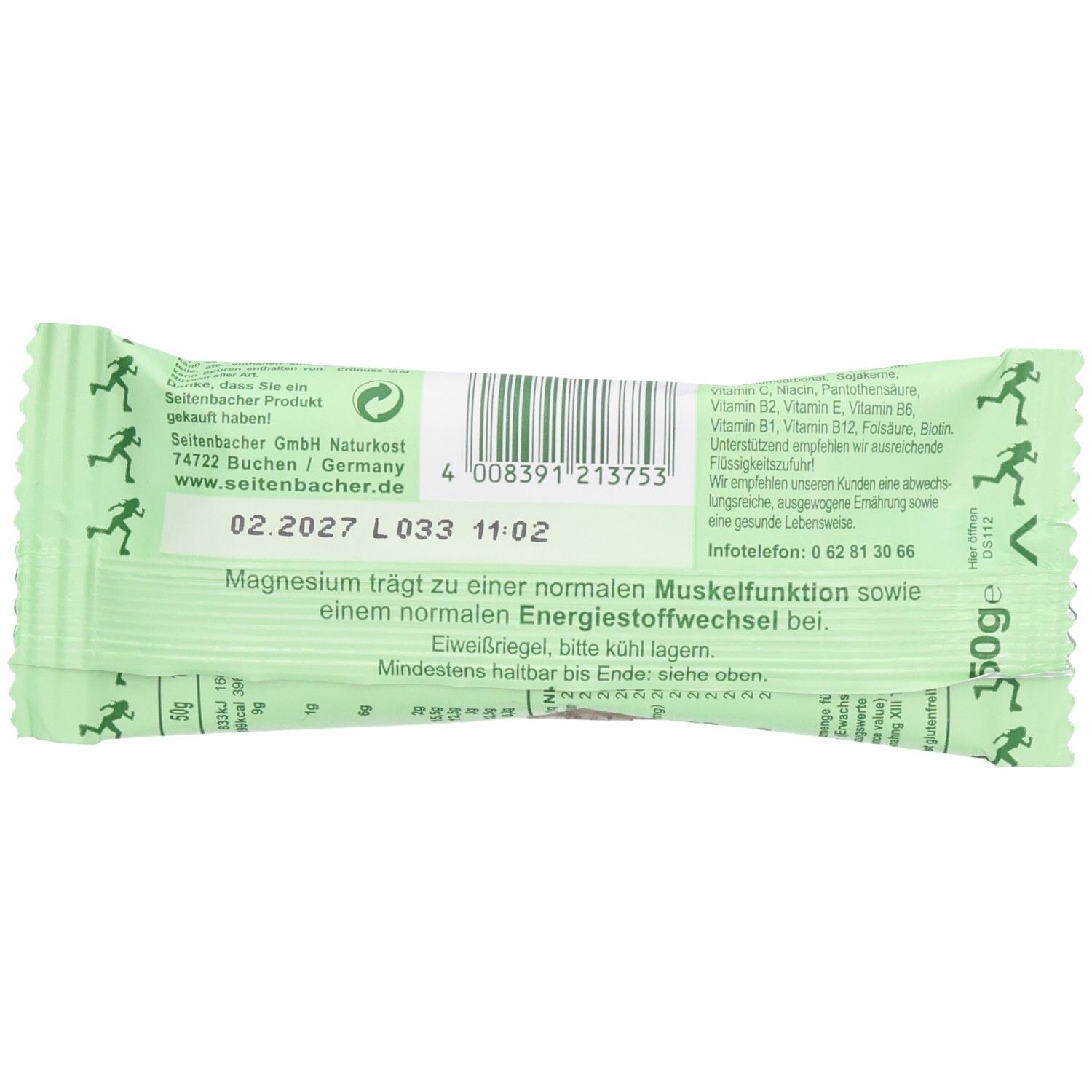 Rückseite der grünen Riegelverpackung. Enthält Text, Barcode und Mindesthaltbarkeitsdatum. Mit Läufer-Symbolen.