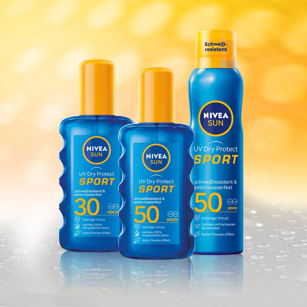 Drei Nivea Sun UV Dry Protect Sport Sonnensprays, LSF 30 und LSF 50, mit gelben Kappen.