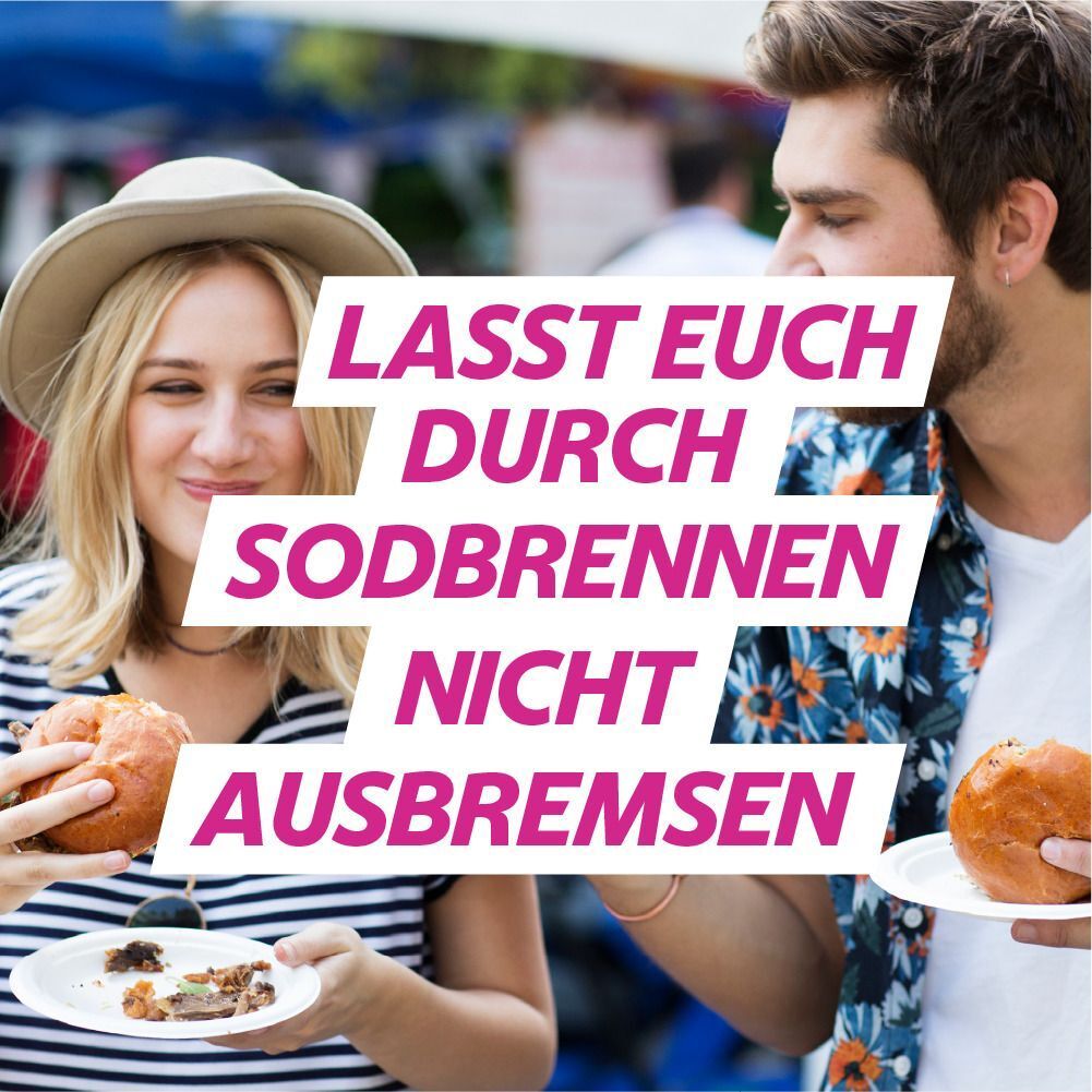 Paar isst Burger. Text: Lasst euch durch Sodbrennen nicht ausbremsen. Hintergrund: verschwommen.