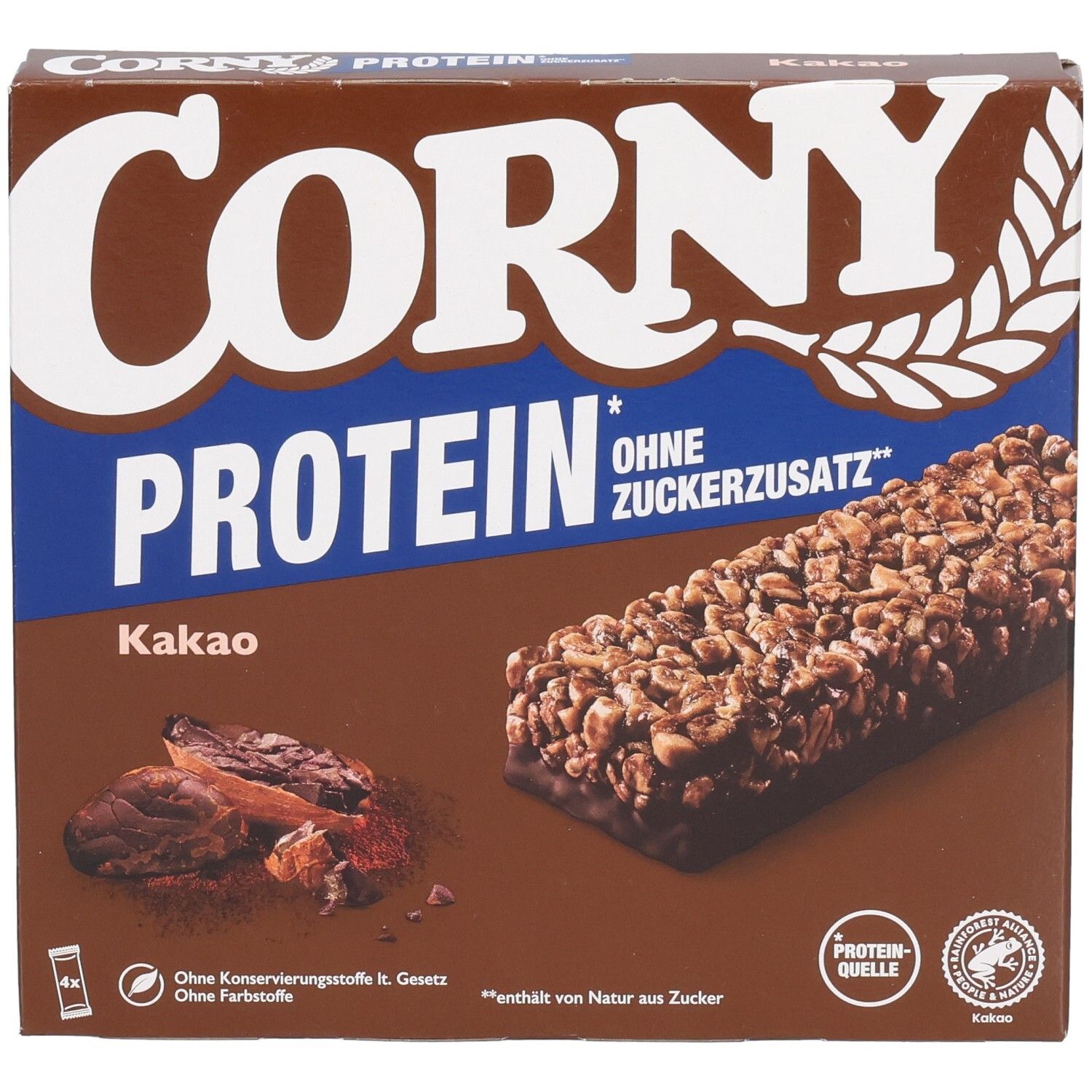 Braune Schachtel mit Corny Protein Kakao. Aufdruck: Corny, Protein, ohne Zuckerzusatz. Abbildung von Riegel und Kakaobohnen.