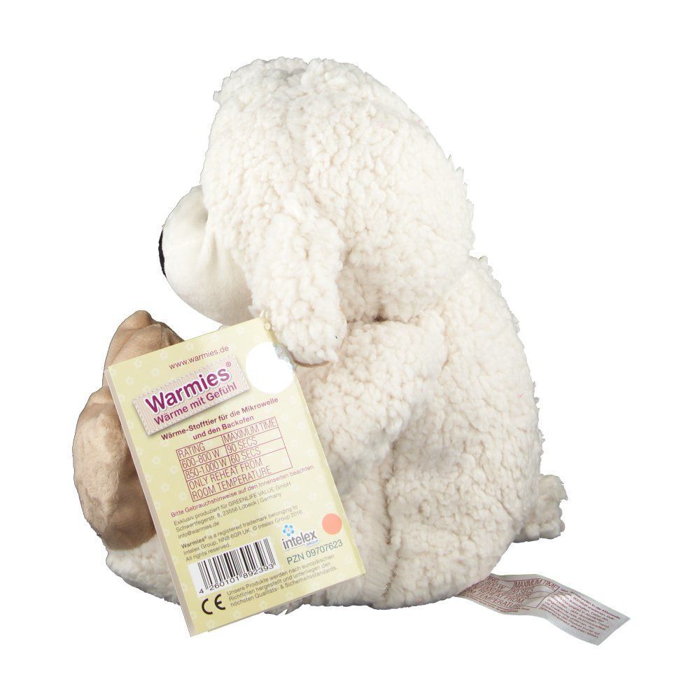 Beige Schaf-Plüschtier von der Seite. Schwarze Nase, beige Füße und Ohren. Ein Etikett ist am Rücken befestigt.