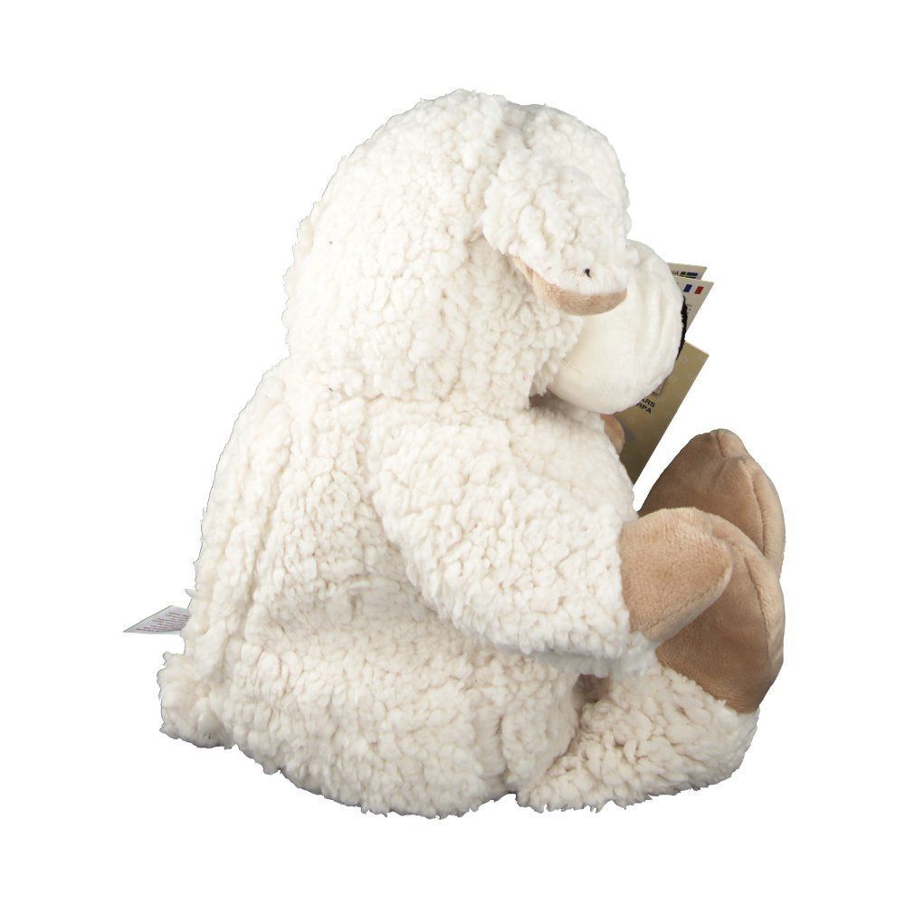 Beiges Schaf-Plüschtier von der Seite. Schwarze Nase, beige Füße und Ohren. Ein Etikett ist am Rücken befestigt.
