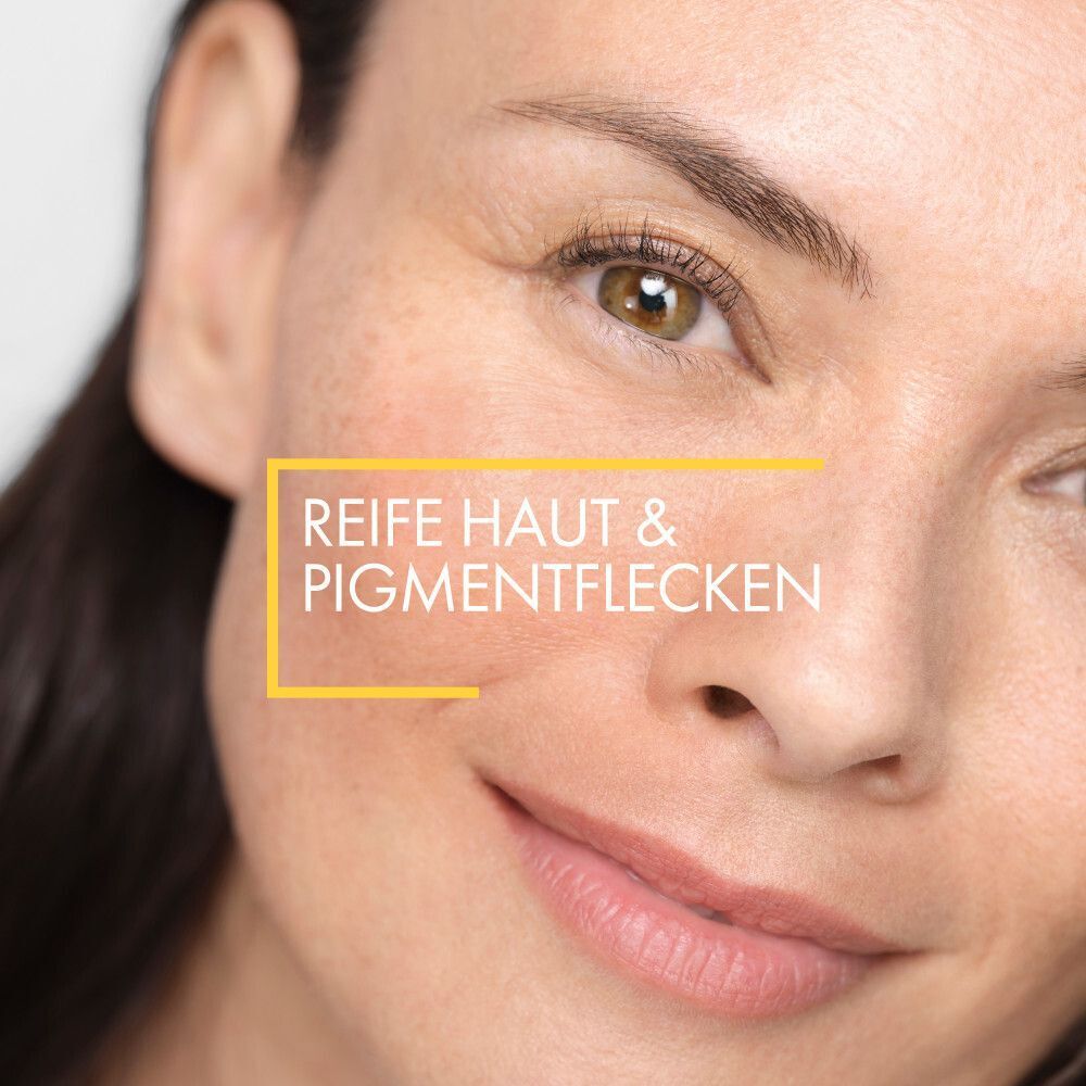 Nahaufnahme eines Gesichts. Text: Reife Haut & Pigmentflecken.