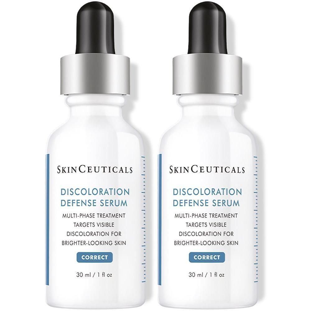 Zwei Flaschen SkinCeuticals Discoloration Defense Serum mit Pipettenverschluss.