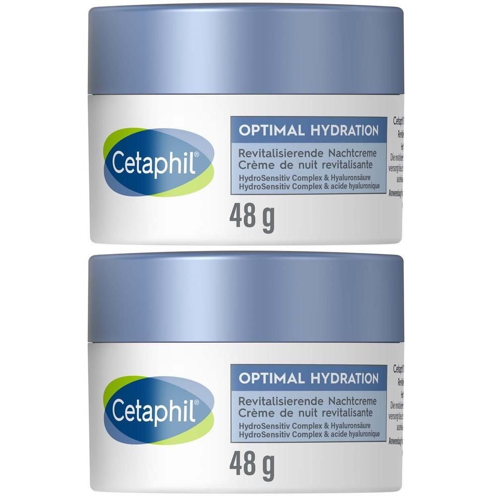 Zwei Tiegel CETAPHIL Optimal Hydration Nachtcreme. Blaue Deckel, weiße Behälter, grüne Logo-Details. 48g.
