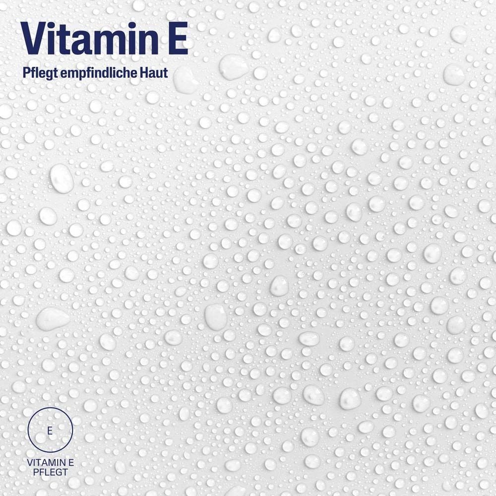 Weißer Hintergrund mit Wassertropfen. Text: Vitamin E pflegt empfindliche Haut. Logo: Vitamin E.