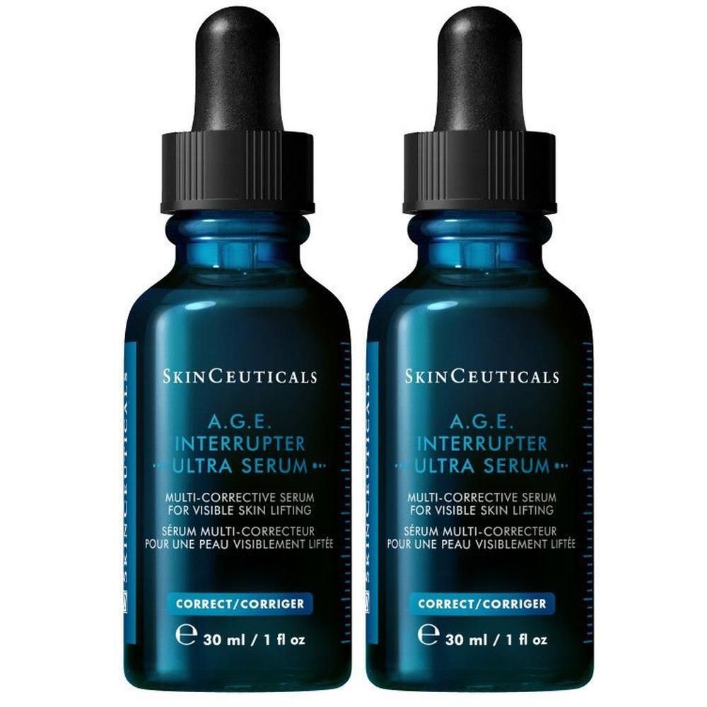 Zwei Flaschen SKINCEUTICALS A.G.E. Interrupter Ultra Serum. Blaue Glasflaschen mit schwarzer Pipette.