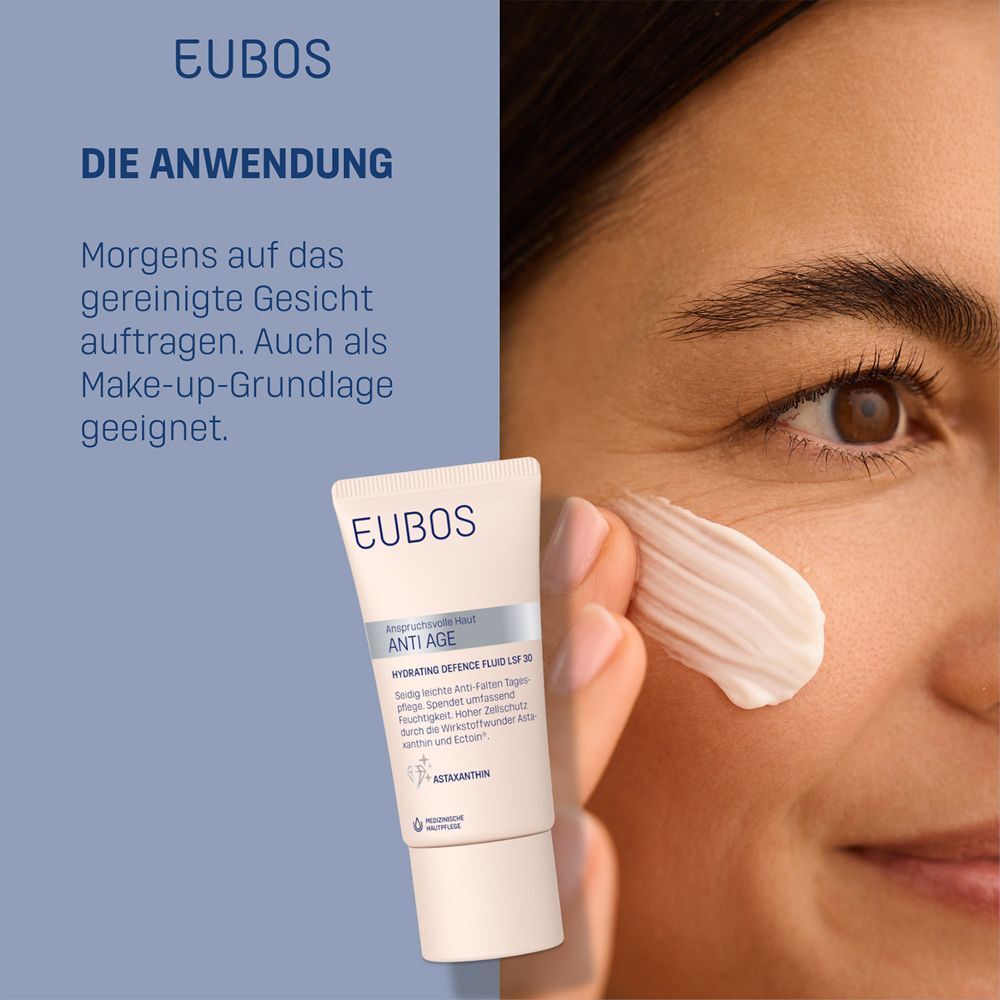 Frau trägt EUBOS ANTI-AGE Hydrating Defence Fluid LSF 30 auf. Text: Morgens auf das gereinigte Gesicht auftragen.