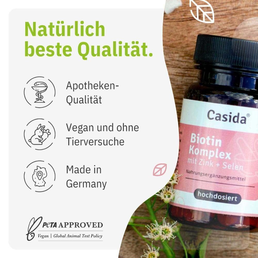 Eine Flasche Casida Biotin Komplex. Braune Flasche mit schwarzem Deckel und rosa Etikett. Apotheken-Qualität, vegan, ohne Tierversuche.