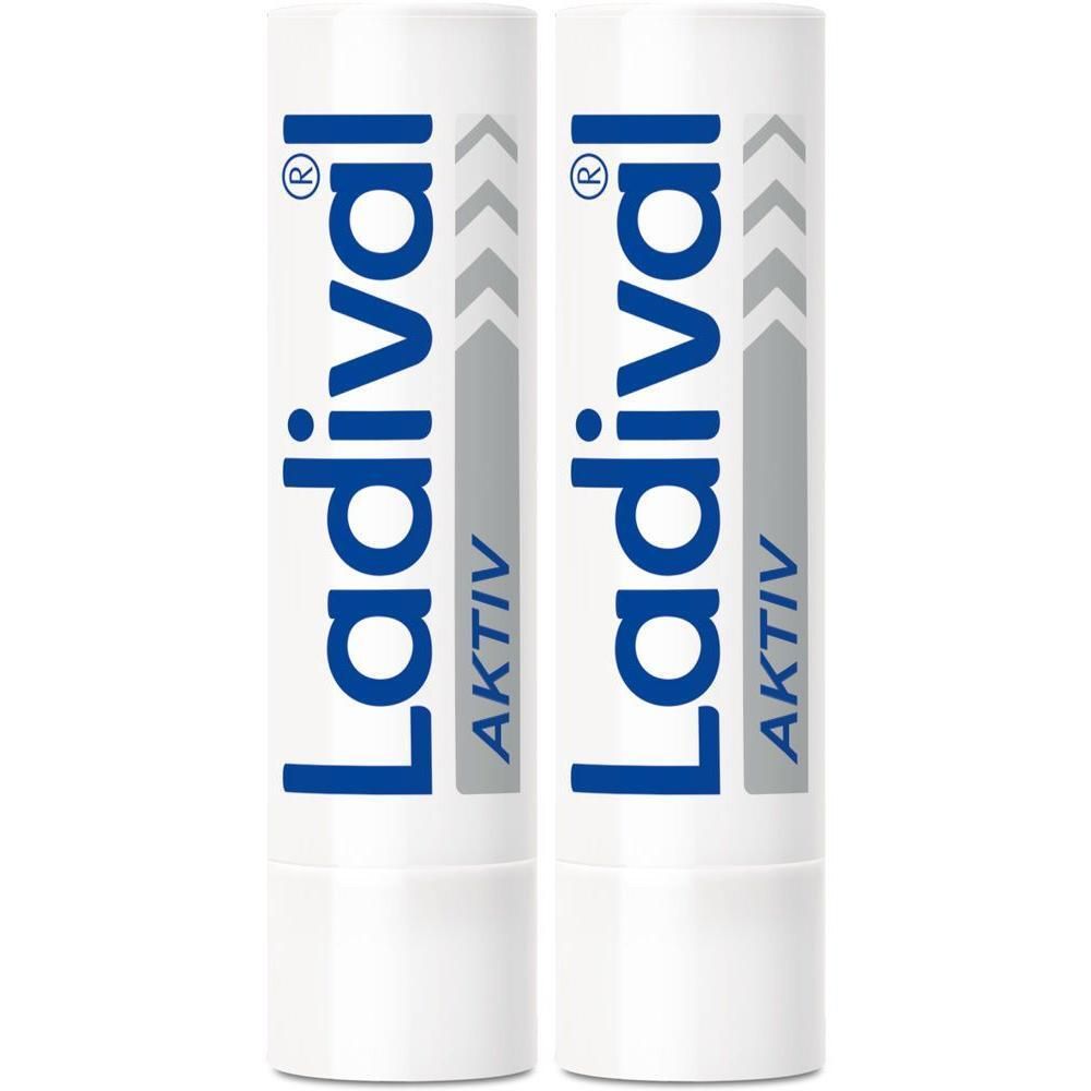 Zwei weiße Lippenpflegestifte mit blauer Aufschrift "LADIVAL AKTIV".