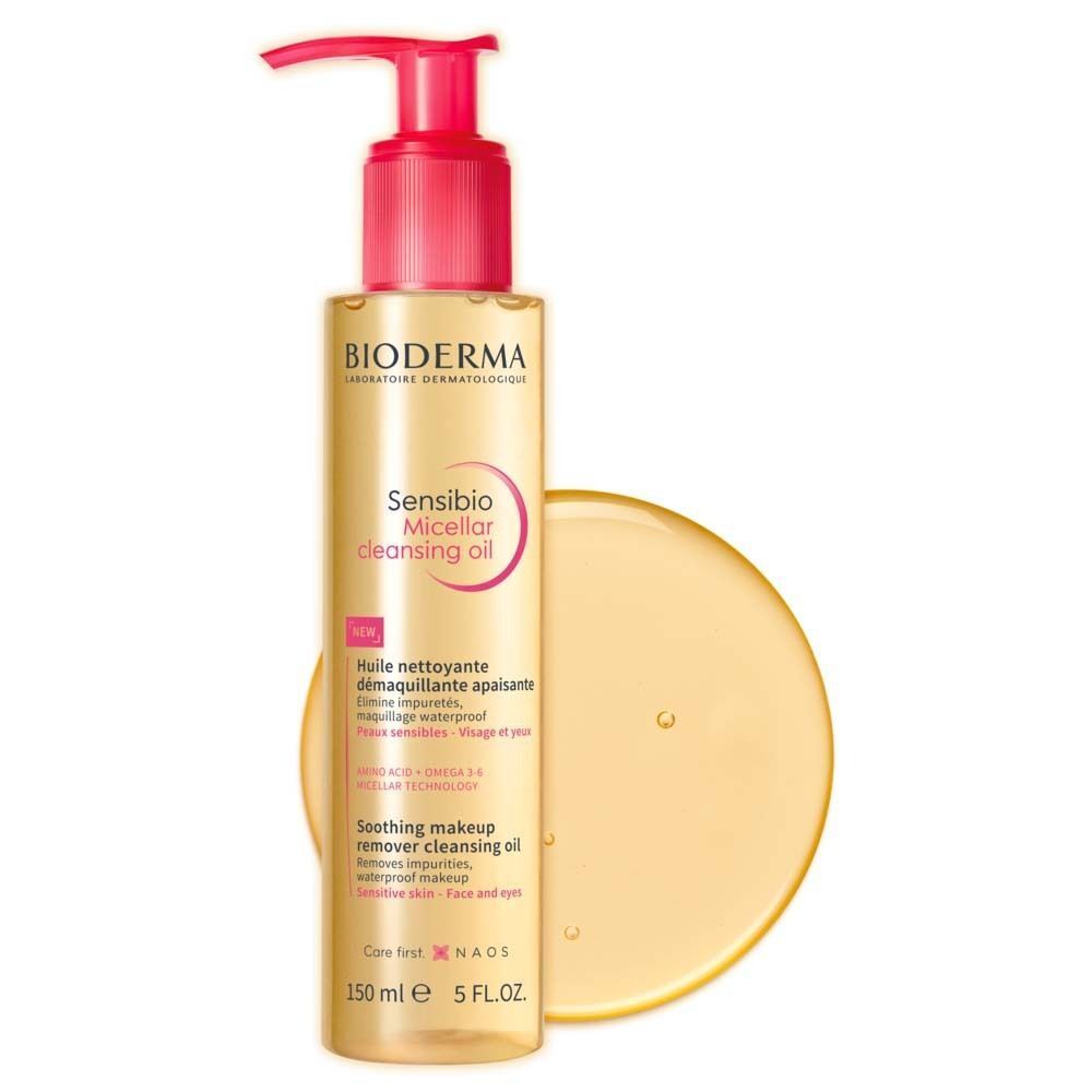 Flasche BIODERMA Sensibio Mizellenreinigungsöl mit gelber Flüssigkeit daneben. Rosa Pumpaufsatz.