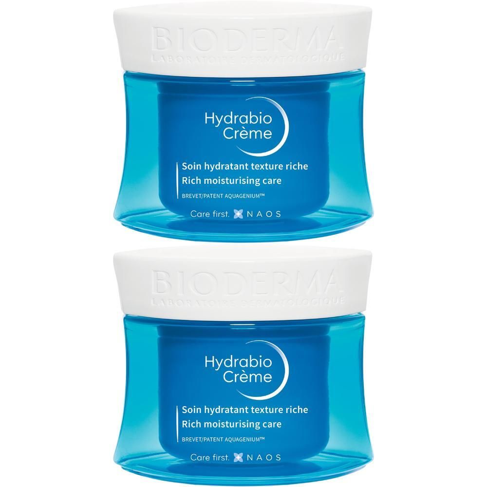 Zwei blaue Tiegel mit weißem Deckel. Aufschrift: BIODERMA, Hydrabio Crème. Text: Soin hydratant texture riche, Rich moisturising care.