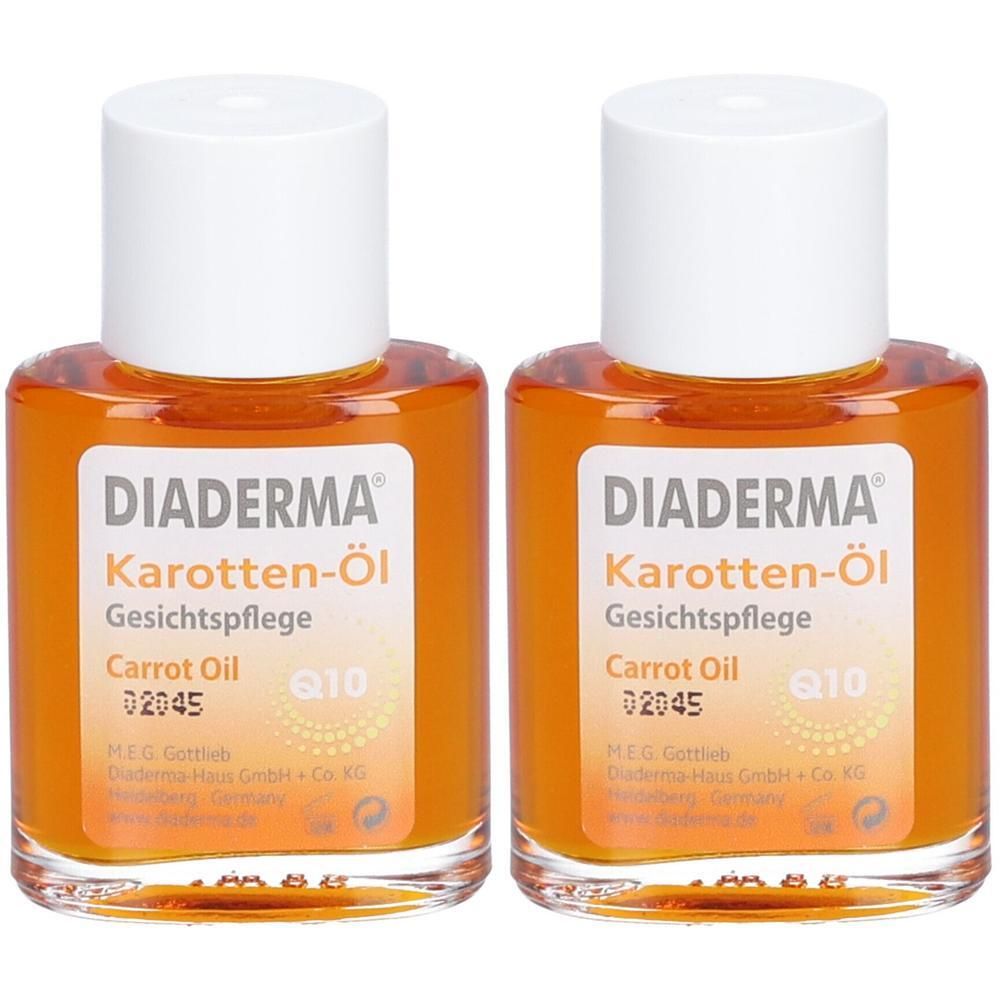 Zwei Flaschen mit orangefarbenem Öl. Auf den Etiketten steht "DIADERMA Karotten-Öl Gesichtspflege". Weiße Deckel.