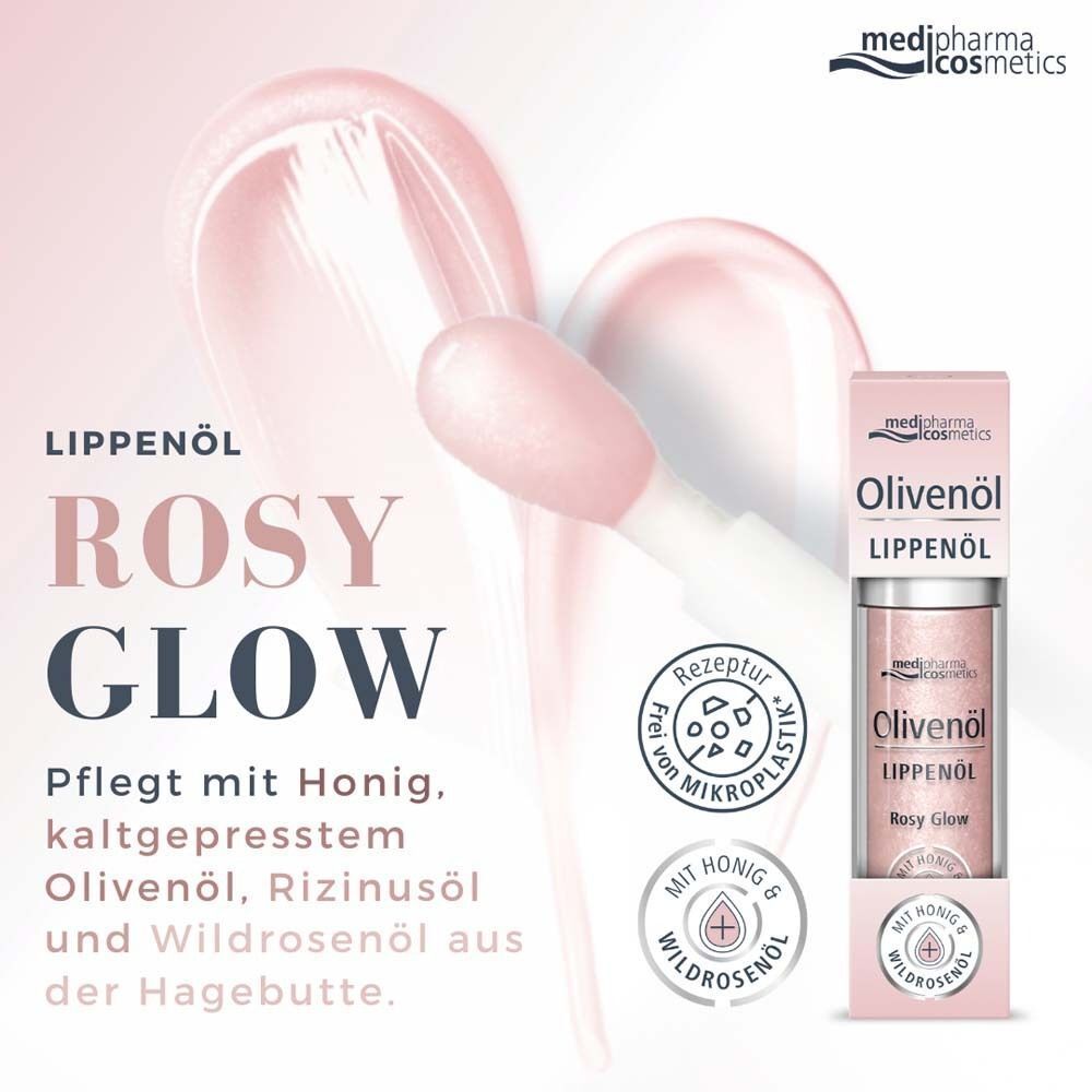 Lippenöl Rosy Glow. Rosa Flüssigkeit in Glasflasche mit silbernem Deckel. Verpackt in rosa Karton. Mit Honig, Olivenöl, Rizinusöl.