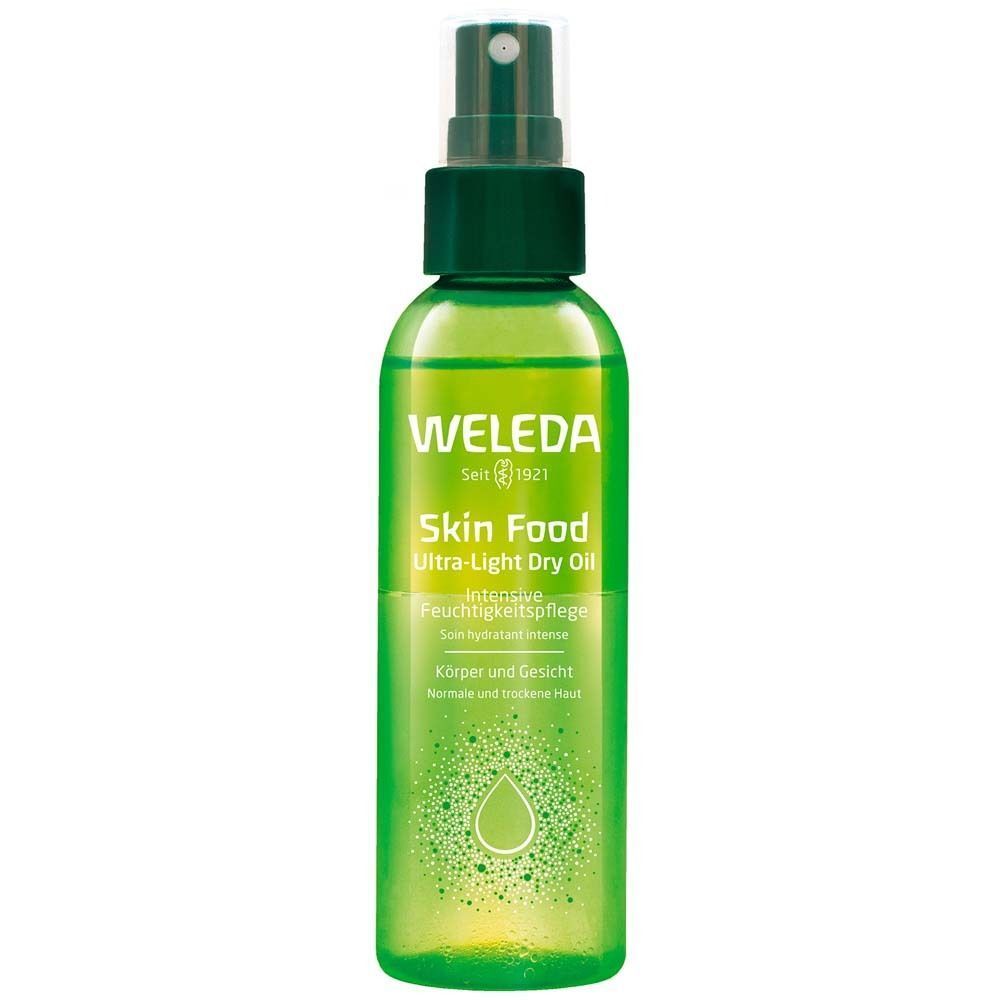 Eine Flasche WELEDA Skin Food Ultra-Light Dry Oil mit grünem Sprühkopf. Grünes Etikett mit Produktnamen und Logo.
