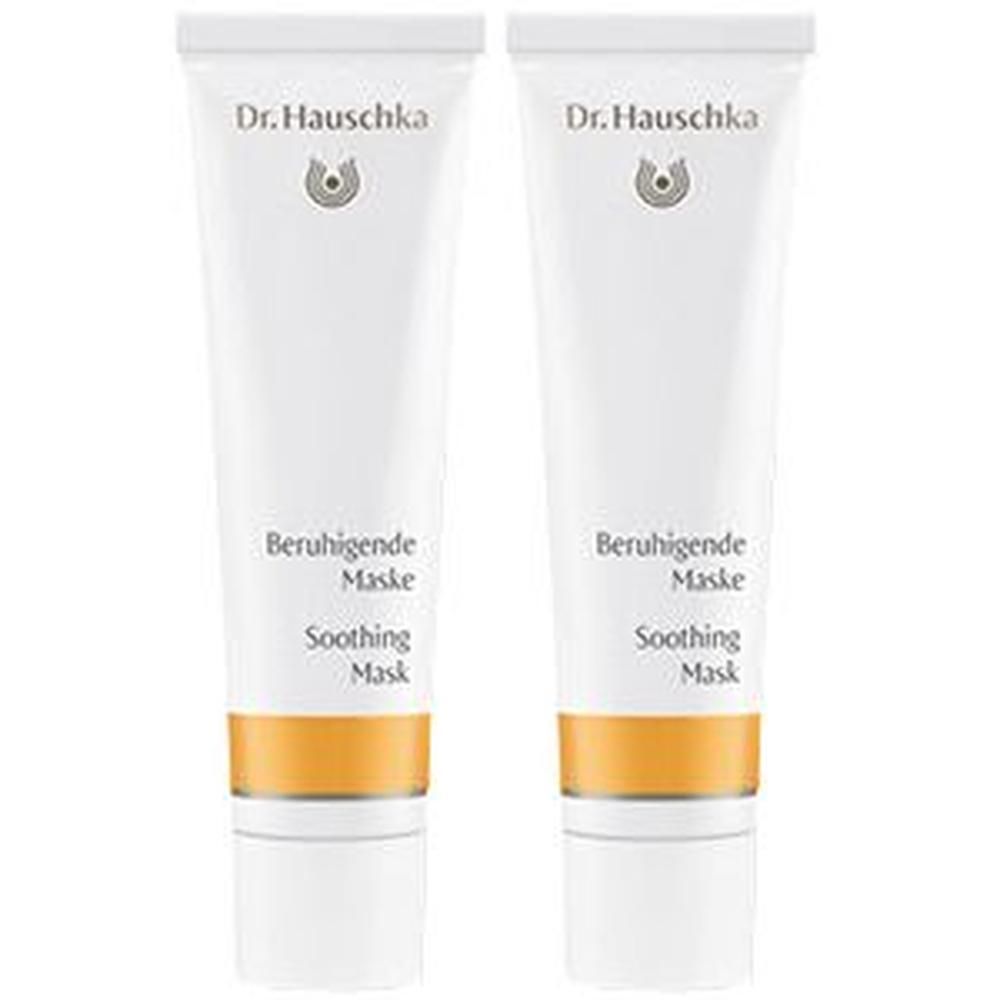 Zwei Dr. Hauschka Beruhigende Maske Tuben mit weißem Verschluss und goldener Banderole.