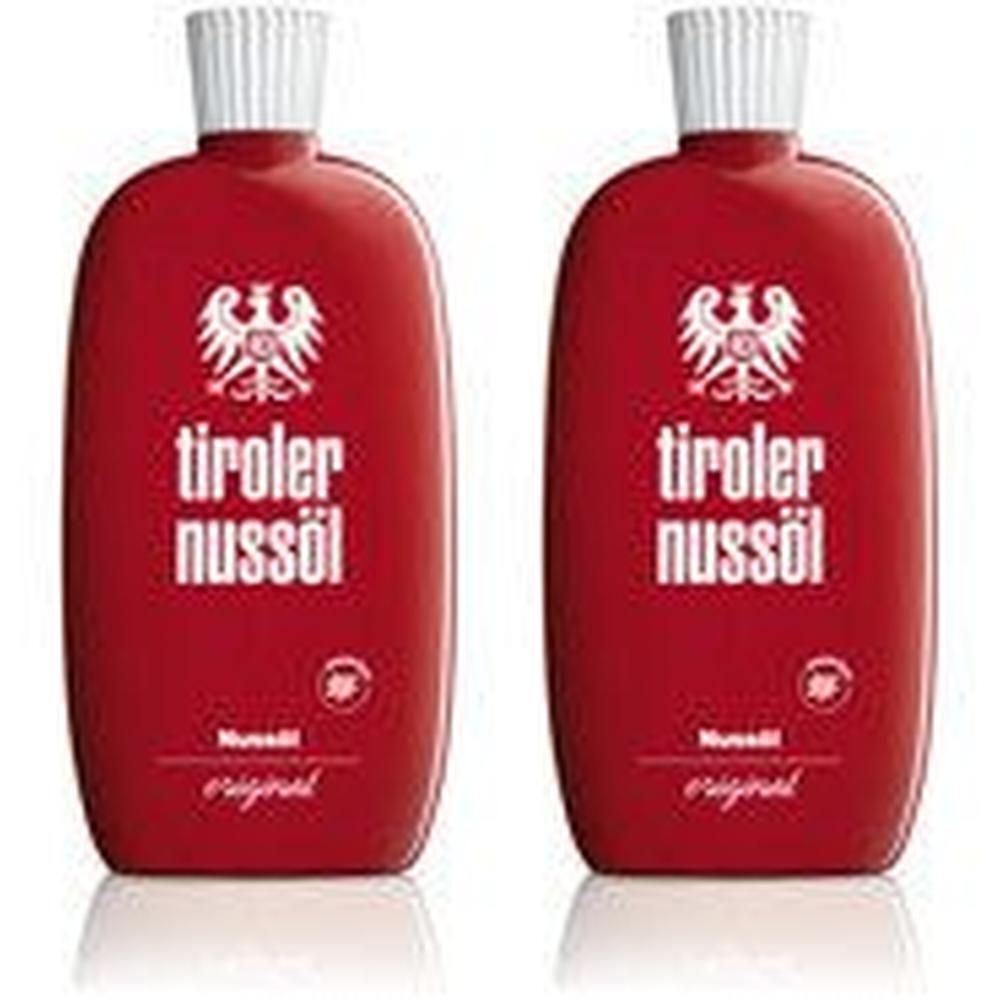 Zwei rote Flaschen mit weißem Verschluss. Aufschrift: tiroler nussöl, darunter ein Adlerwappen. Darunter: original.