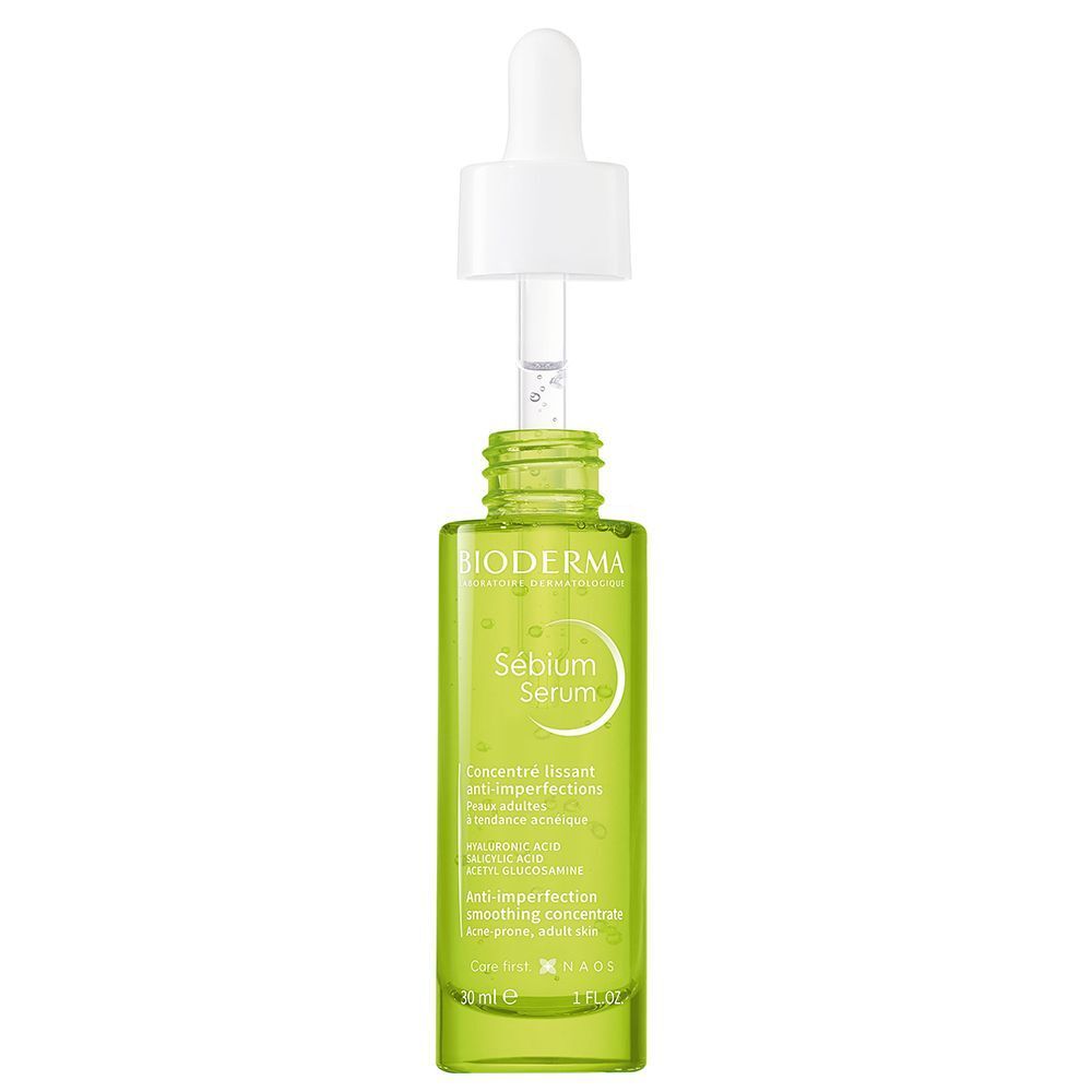 Grüne Flasche mit weißem Deckel und Pipette. Aufschrift: BIODERMA, Sébium Serum. Anti-Unreinheiten, glättendes Konzentrat. 30 ml.