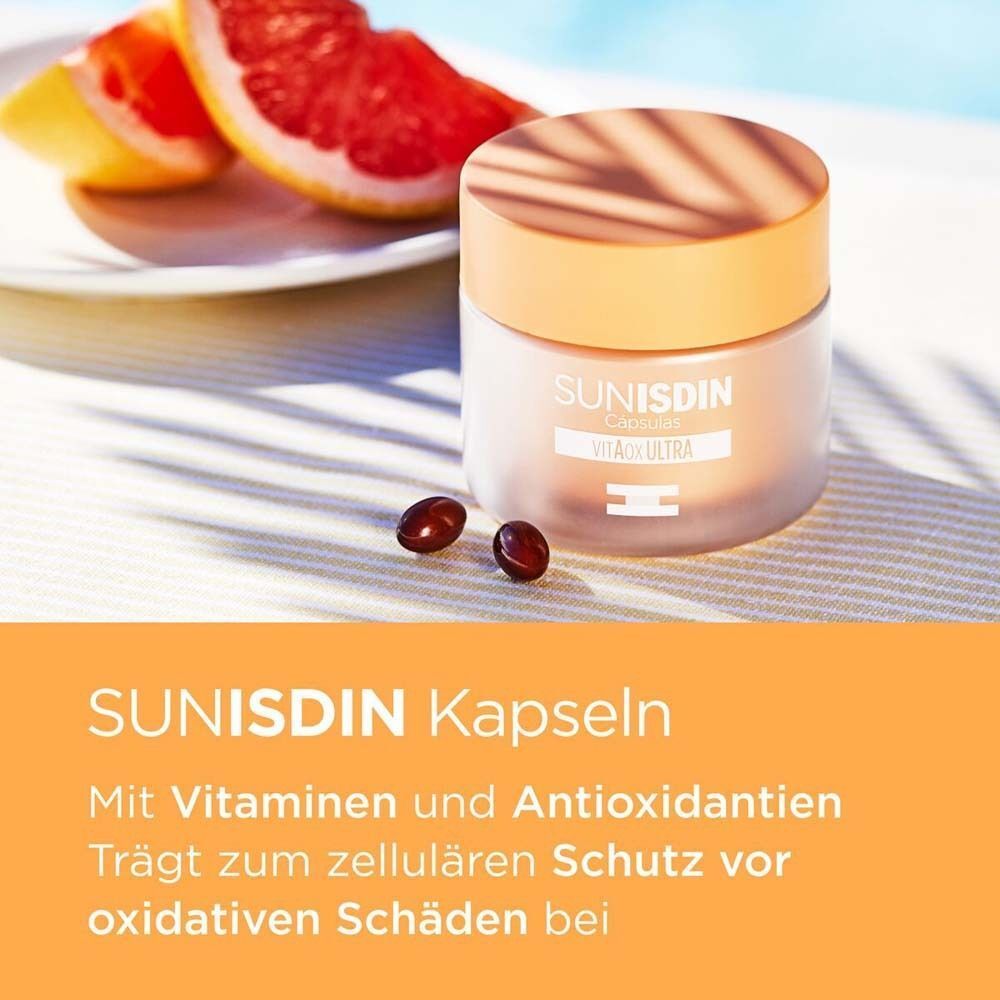 SunISDIN Kapseln Dose mit Kapseln und Grapefruit. Text: Mit Vitaminen und Antioxidantien. Trägt zum zellulären Schutz bei.