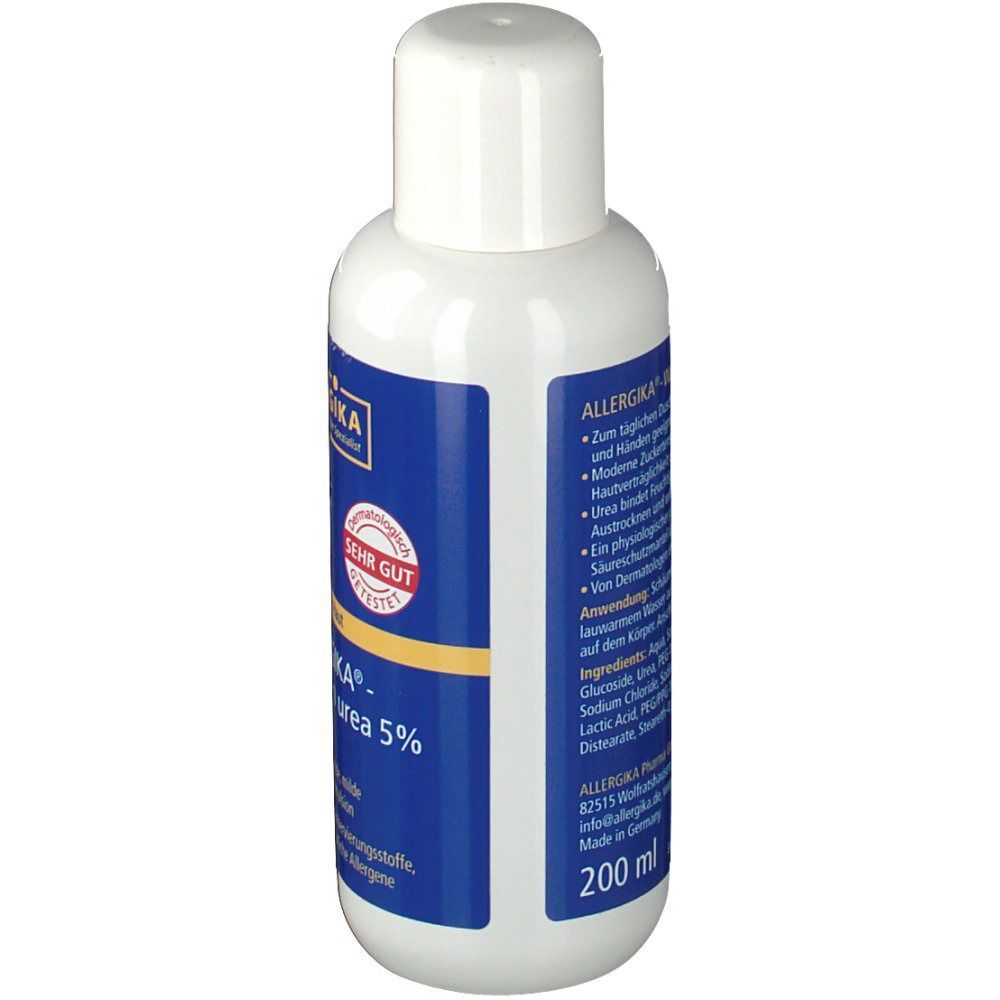 Weiße Flasche ALLERGIKA® Waschlotion Urea 5% mit blauem Etikett und weißem Deckel. Aufschrift: SEHR GUT. Rückseite mit Text.